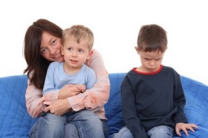 mother and two sons on the sofa - portrait